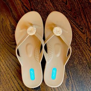 Oka B sand colored flip flops